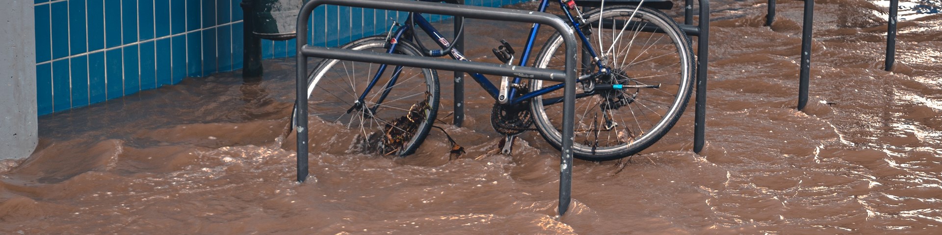 a bike outside a building in a flood